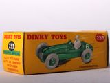a box of dinky toys sitting on a white surface