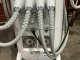 a machine that is sitting on a cart with hoses