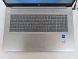 a laptop computer sitting on top of a white table