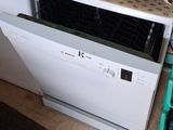 a microwave and a dishwasher in a small kitchen
