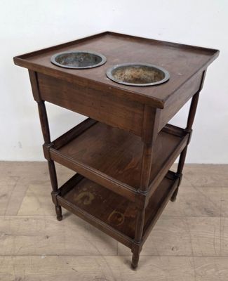 a wooden table with two bowls on top of it