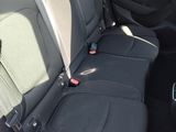the back seats of a car are black in color