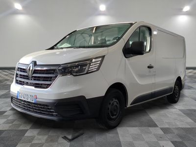 the white van is parked on a checkered floor in a room