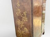 an image of a wooden cabinet with a floral design on it