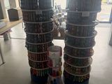 two stacks of dvds stacked on top of each other in a store