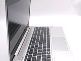 a close up of a laptop computer on a white surface