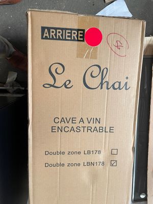 a box of wine that is sitting on the ground