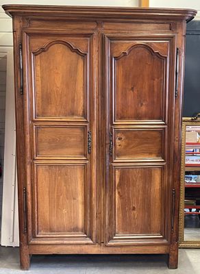 an image of a wooden armoire with a mirror on top of it