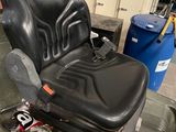 an image of a black chair in a garage