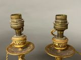 pair of antique brass candlesticks with figurines and chains