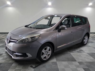 a picture of a silver car parked in a garage