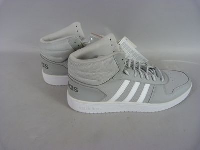 grey and white adidas sneakers with white soles on a white surface