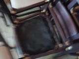 many chairs that are stacked together on the floor