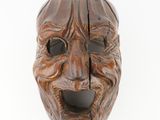 an old wooden mask on a white background with a white background