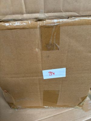 a cardboard box with a sticker on it sitting on the floor