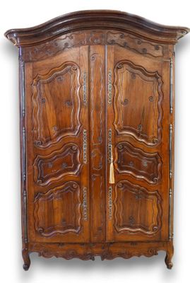 an image of a wooden armoire with two doors and a gold handle