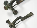 pair of antique bronze hair clips with green and black pating