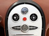 a close up of a car dashboard with a clock on it