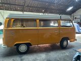 a yellow van that is parked in a garage