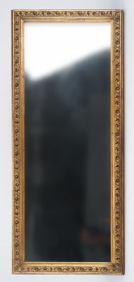 a mirror hanging on the wall in a room