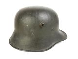 an old helmet with a hole in the middle of it
