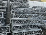 a large pile of scaffolding in front of a building