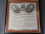 a framed picture of two men in suits and a coat of arms