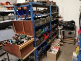 a garage with a lot of tools on the shelves