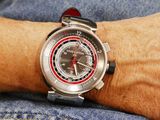 a man that is wearing a watch on his wrist