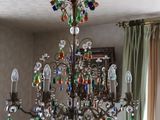 a chandelier that is hanging from the ceiling in the room