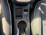 the interior of a car with the center console in the center of it