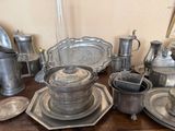 a table with a lot of silver items on it