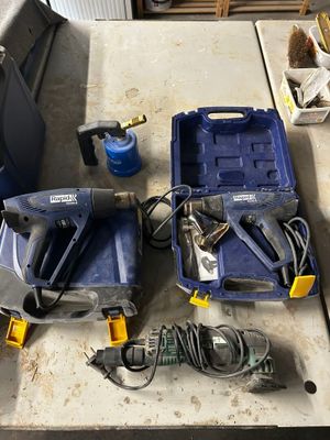 tools that are sitting on a table in the garage