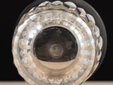 a close up of a clear glass vase on a table