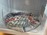 a microwave that has a lot of newspapers inside of it
