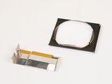 a close up of a piece of metal and a piece of plastic