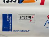 many different logos on the side of a white bag