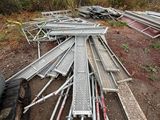 a pile of metal pipes that are laying on the ground