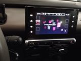 a picture of a car dashboard with a game on the screen