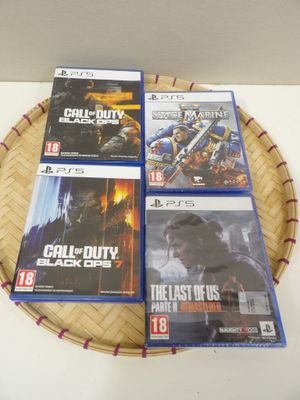 four video games in a basket on top of a table