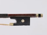 a close up of a violin bow on a white background