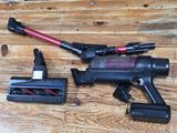 a cordless vacuum and a cordless vacuum on a wooden table