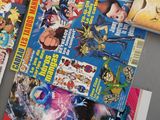 a lot of comic books on the table together