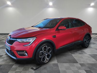 a red suv parked in a garage with a checkered floor
