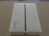 a white box on a table that has a picture of an apple logo on it