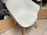 a white chair in the corner of a room