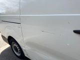 a white van that is parked on the side of the road