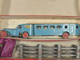 a blue toy bus in a box with other toys