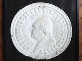 a picture of a plaque of a man in profile