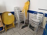 many chairs and tables in a room with a yellow umbrella